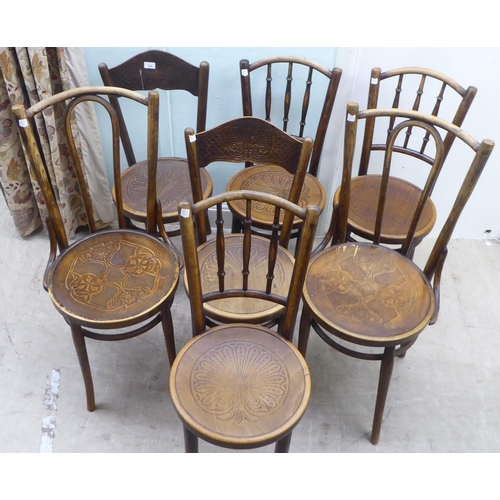 153 - A set of three early 20thC Mundis bentwood chairs with solid, stencilled seats; and two similar pair... 