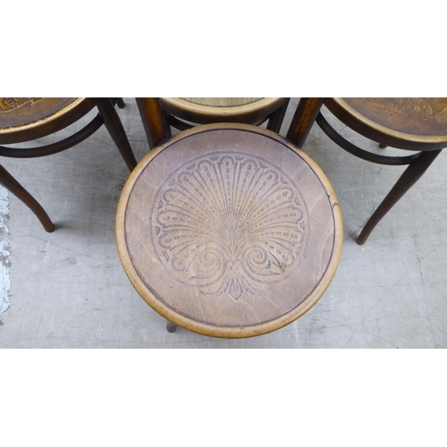 153 - A set of three early 20thC Mundis bentwood chairs with solid, stencilled seats; and two similar pair... 