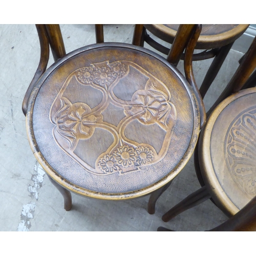 153 - A set of three early 20thC Mundis bentwood chairs with solid, stencilled seats; and two similar pair... 