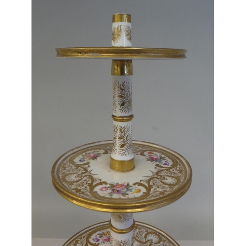 154 - A late 19thC floral painted and gilded china three tier stand, on a circular base  16