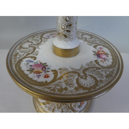 154 - A late 19thC floral painted and gilded china three tier stand, on a circular base  16