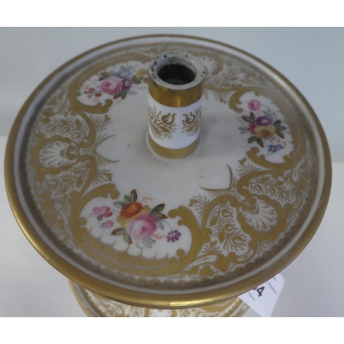 154 - A late 19thC floral painted and gilded china three tier stand, on a circular base  16