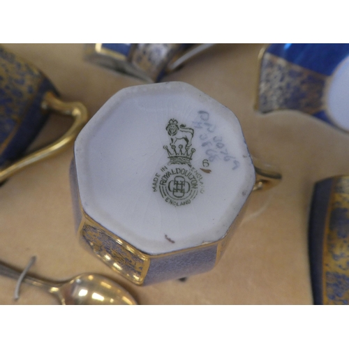 155 - A 1930s set of six Royal Doulton china octagonal shaped coffee cups and saucers with sponged blue an... 