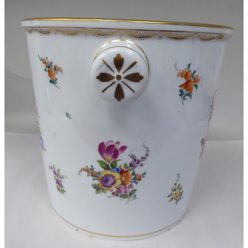 16 - A 19thC porcelain pail with opposing knob handles, decorated with mixed floral sprigs and gilding  1... 