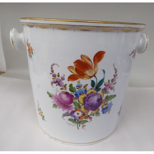 16 - A 19thC porcelain pail with opposing knob handles, decorated with mixed floral sprigs and gilding  1... 