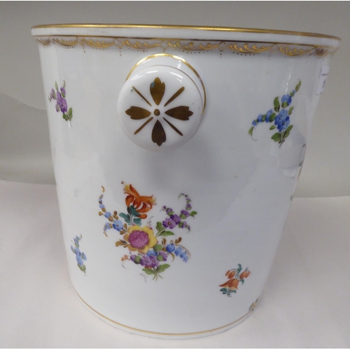 16 - A 19thC porcelain pail with opposing knob handles, decorated with mixed floral sprigs and gilding  1... 