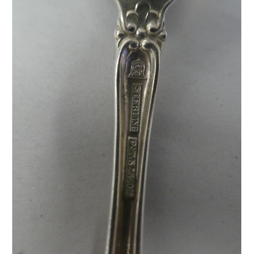 164 - Sterling silver flatware: to include ten teaspoons with decoratively scrolled terminals; two servers... 