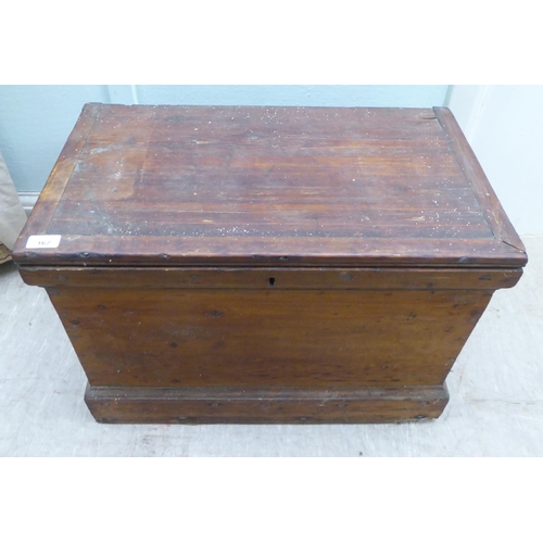 167 - An early 20thC pine chest with a hinged lid  18