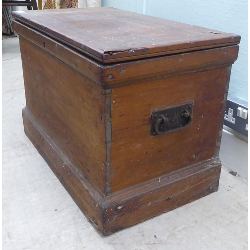 167 - An early 20thC pine chest with a hinged lid  18