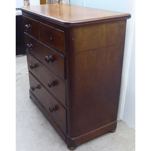 168 - A late Victorian mahogany dressing chest, the two short/three long drawers with bun handles  42... 