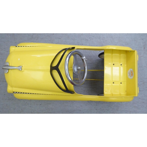 17 - A Burns model pedal car, in the form of a New York yellow cab with rubber wheels  33