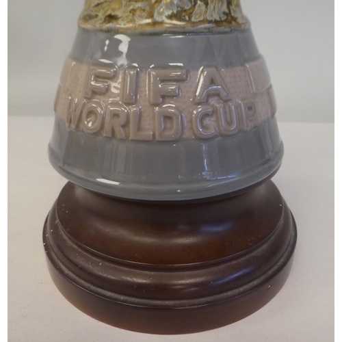 170 - A Lladro porcelain model, a football World Cup trophy, on an associated plinth  15