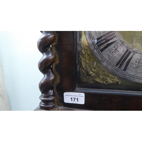 171 - A late 18thC walnut figured mahogany and marquetry longcase clock; the hood with a straight top and ... 