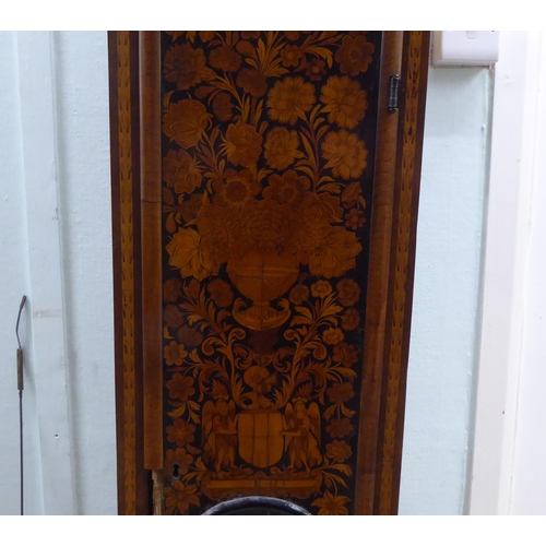 171 - A late 18thC walnut figured mahogany and marquetry longcase clock; the hood with a straight top and ... 