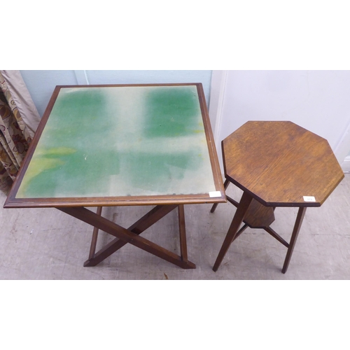 173 - An early 20thC light oak octagonal side table, raised on square, tapered legs  27