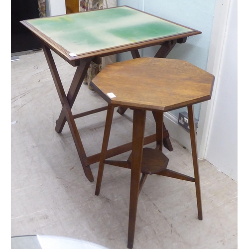 173 - An early 20thC light oak octagonal side table, raised on square, tapered legs  27