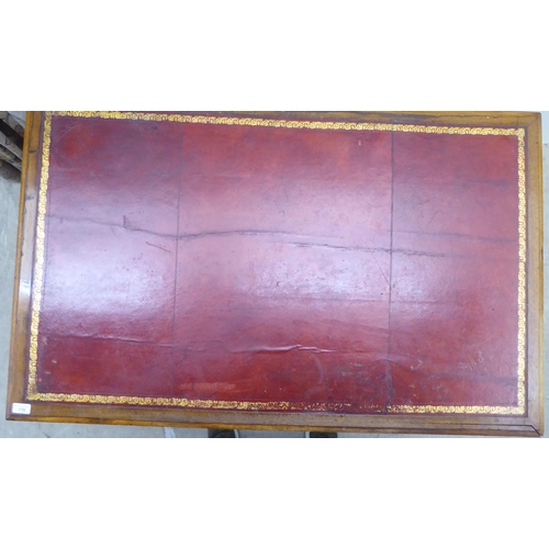 176 - A late Victorian mahogany nine drawer on a twin pedestal desk with a tooled oxblood coloured hide sc... 