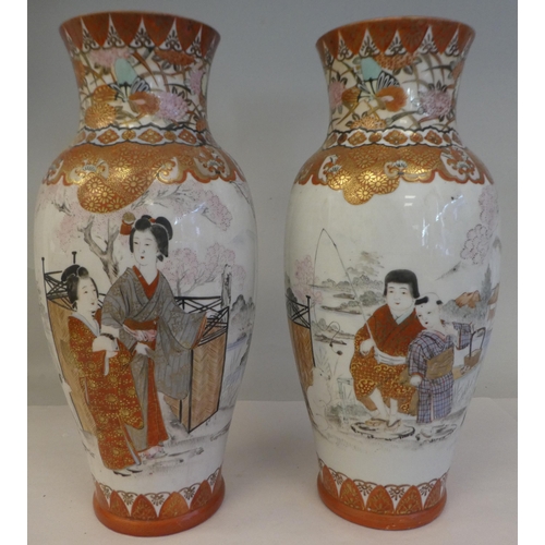 180 - A pair of late 19th/early 20thC Kutani porcelain baluster shape vases, traditionally decorated in ir... 