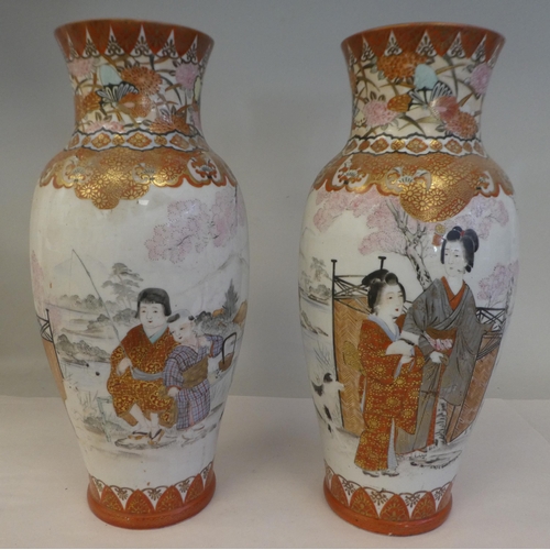 180 - A pair of late 19th/early 20thC Kutani porcelain baluster shape vases, traditionally decorated in ir... 