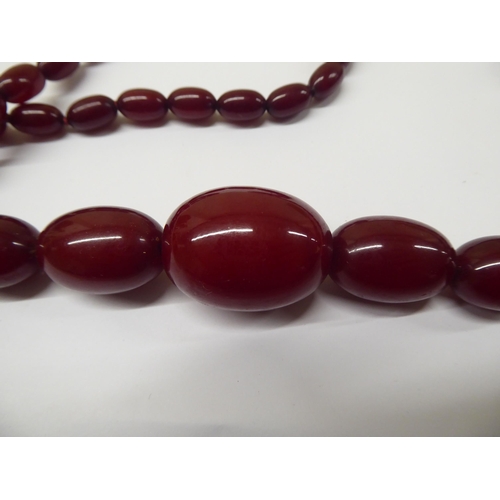 181 - A cherry amber coloured graduated bead necklace 