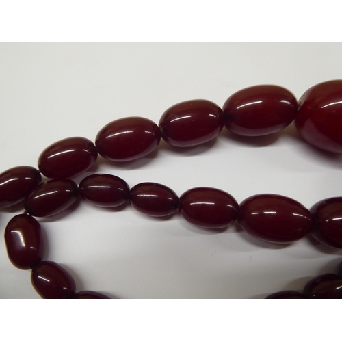 181 - A cherry amber coloured graduated bead necklace 