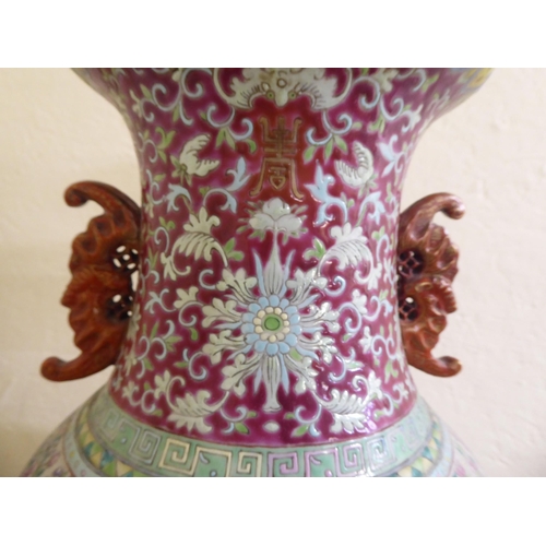 190 - A late 19thC Chinese porcelain table lamp of waisted form, decorated in pastel tones with birds amon... 