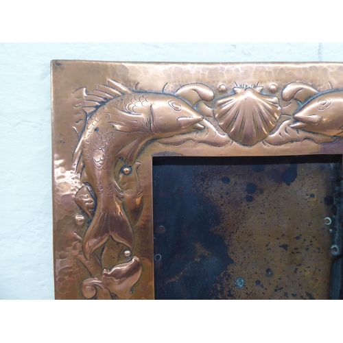 203 - An Arts & Crafts period Newlyn School spot-hammered and pressed copper photograph frame, decorat... 