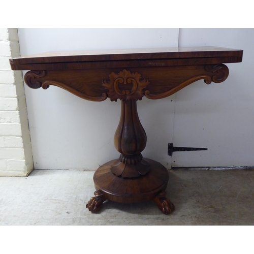 209 - A William IV rosewood card table, the rotating foldover top raised on a bulbous, reeded, pedestal, o... 