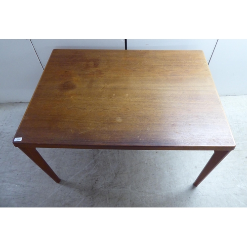 223 - A circa 1970s teak draw leaf dining table by Henning Kjærnulf for Vejle Stole Mobelfabrik of Denmark... 