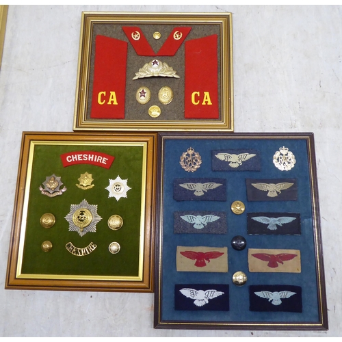 225 - Variously themed fabric and other badges, displayed on fabric covered boards and frame (Please Note:... 