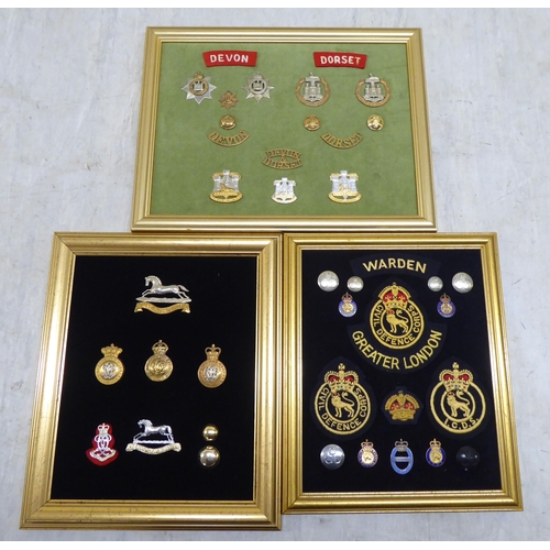 225 - Variously themed fabric and other badges, displayed on fabric covered boards and frame (Please Note:... 