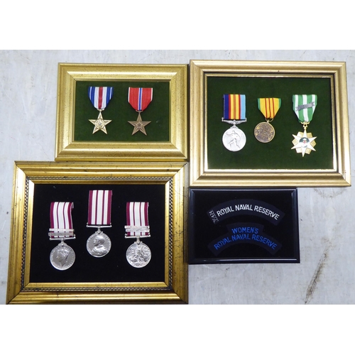 228 - Variously themed replica medals and badges, on presentation fabric backed display boards (Please Not... 