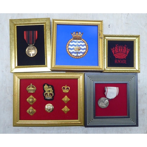 228 - Variously themed replica medals and badges, on presentation fabric backed display boards (Please Not... 