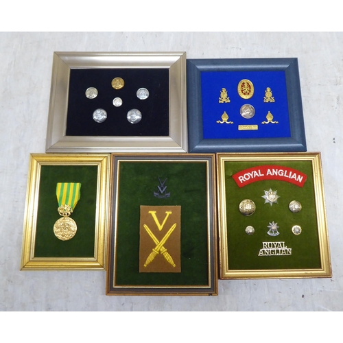 228 - Variously themed replica medals and badges, on presentation fabric backed display boards (Please Not... 