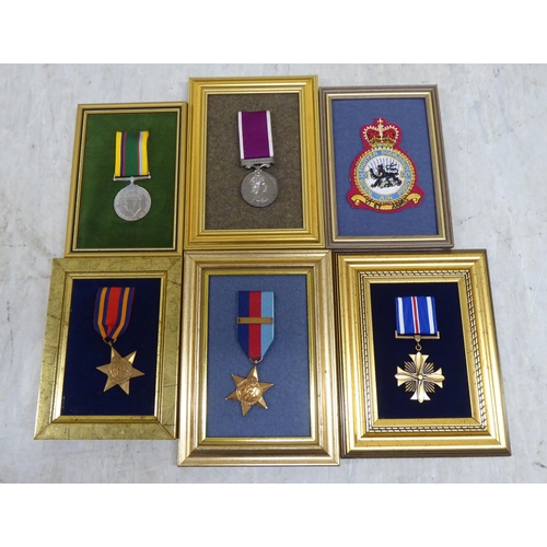 228 - Variously themed replica medals and badges, on presentation fabric backed display boards (Please Not... 