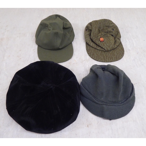 230 - Hats: to include military helmets, peaked caps and berets(Please Note: this lot is subject to the st... 