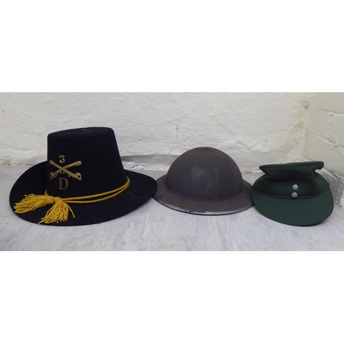 230 - Hats: to include military helmets, peaked caps and berets(Please Note: this lot is subject to the st... 