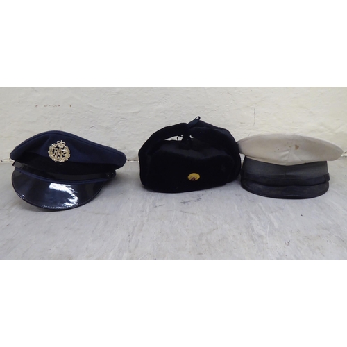 230 - Hats: to include military helmets, peaked caps and berets(Please Note: this lot is subject to the st... 