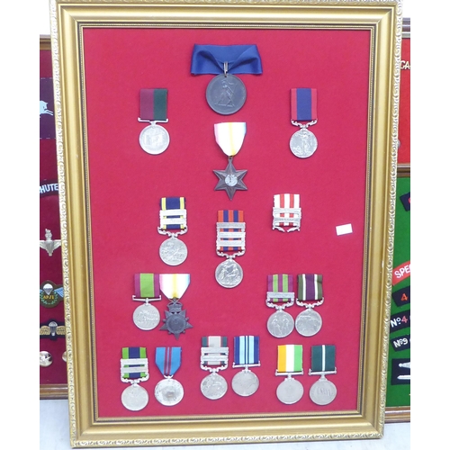 232 - Five framed displays of replica medals and fabric badges (Please Note: this lot is subject to the st... 