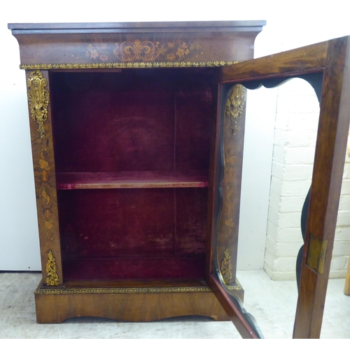 237 - A late Victorian walnut and floral marquetry pier cabinet with ormolu gilt mounts, the glazed door e... 