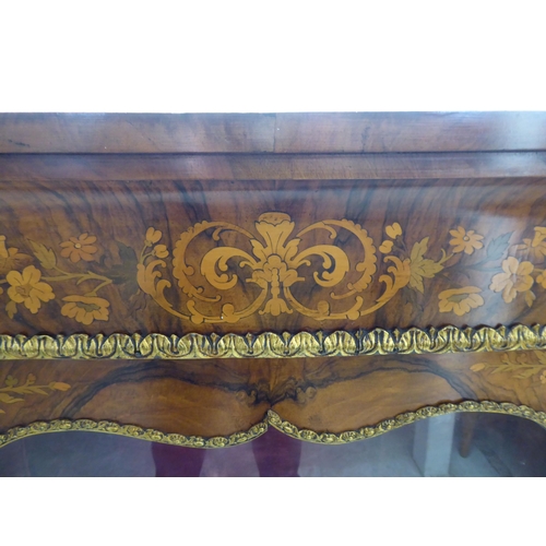 237 - A late Victorian walnut and floral marquetry pier cabinet with ormolu gilt mounts, the glazed door e... 