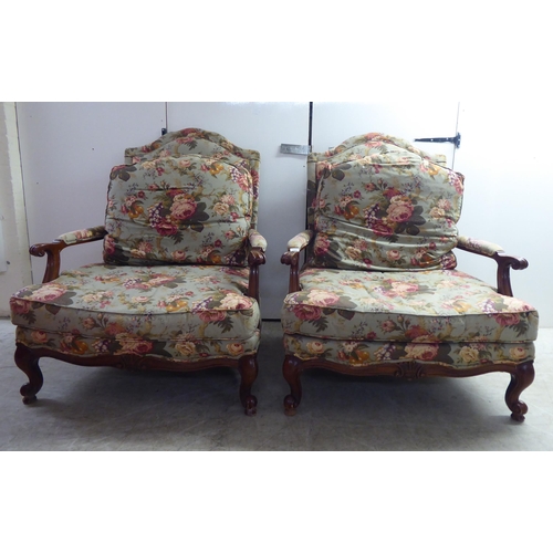 243 - A pair of modern Woodmark, a Howard Miller Co., stained beech showwood framed 'oversize' open arm sa... 