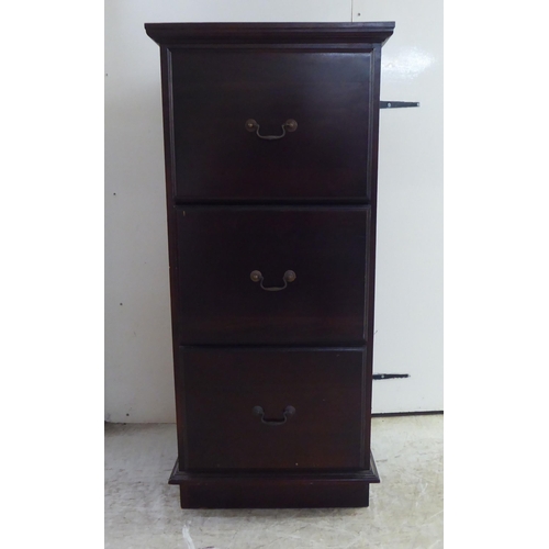 253 - A modern mahogany three drawer filing cabinet, on a plinth  45