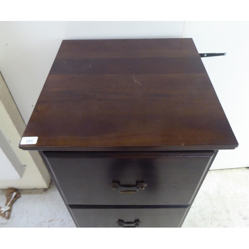 253 - A modern mahogany three drawer filing cabinet, on a plinth  45