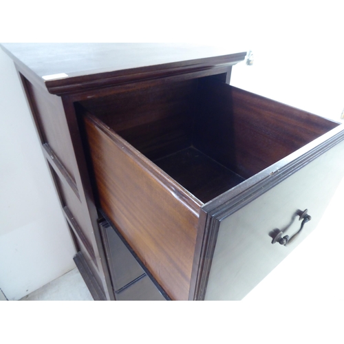 253 - A modern mahogany three drawer filing cabinet, on a plinth  45