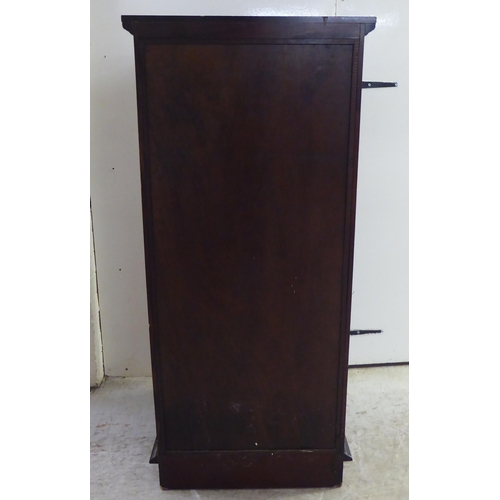 253 - A modern mahogany three drawer filing cabinet, on a plinth  45