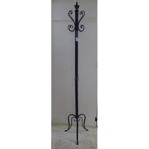 254 - A modern walnut and cast black painted metal hat/coat stand  70