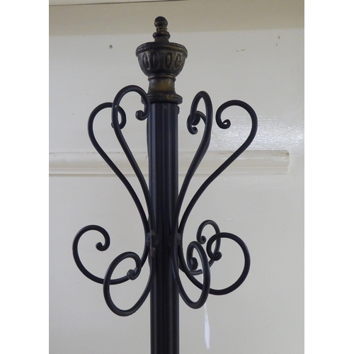 254 - A modern walnut and cast black painted metal hat/coat stand  70