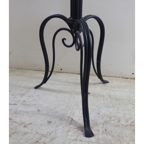 254 - A modern walnut and cast black painted metal hat/coat stand  70