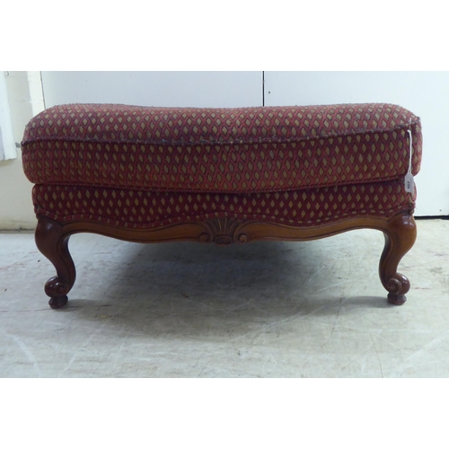 256 - A modern diamond formation pattern fabric upholstered footstool, raised on cabriole legs 